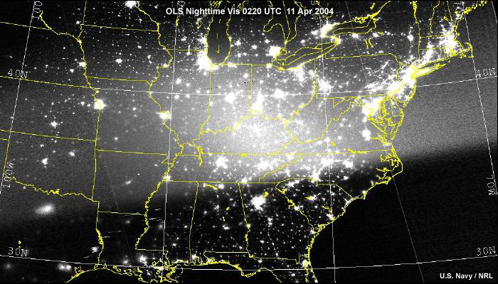 OLS nighttime visible image over the eastern US at full moon. The moon is below the horizon and solar glare contaminates the scene
