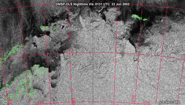 OLS nighttime visible over the Antarctic showing ice edges covered by thin clouds